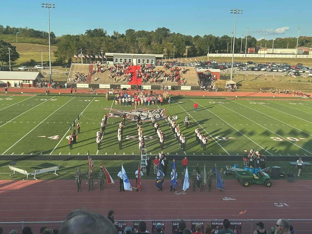 Band and color guard at a football game