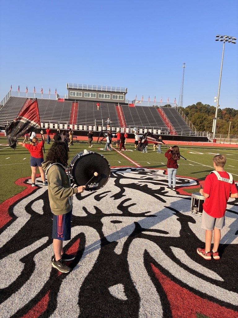 McDonald County High School marching band rehearsing on the football field